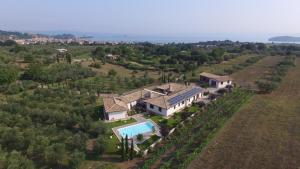 an aerial view of a house with a swimming pool at Borgo Sacramento in Marta