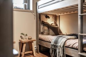 a small bedroom with a bunk bed in a house at Fjällviddsvägen 224 in Idre Fjäll