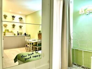 a view of a kitchen and a dining room at Giardino Botanico in Ragusa +41 photos
