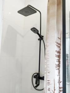 a black lamp sitting next to a window at Aquamarine Premium 5 Bedroom Duplex in Lagos in Lekki +11 photos