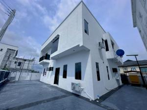 a white building with windows on the side of it at Aquamarine Premium 5 Bedroom Duplex in Lagos in Lekki