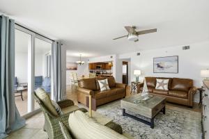 a living room with a couch and a table at SeaSpray Riverside 712 in Perdido Key