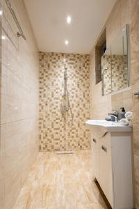 a bathroom with a sink and a shower at Hotel Cheese in Shumen +54 photos