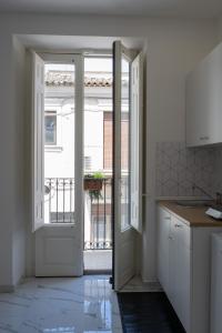 an open door to a kitchen with a balcony at Renna's in Grammichele