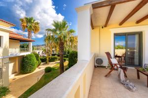 a villa with a view of the ocean at Ionian Coco Palm Beach Villas in Tsilivi