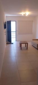 a room with a bench in the middle of a room at Edificio San Jose in Federación