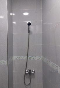 a shower with a shower head in a bathroom at La Chambre d hote in Ouarzazate