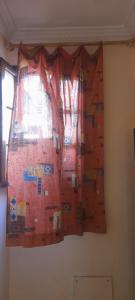 a climbing wall in a room with a window at La Chambre d hote in Ouarzazate