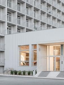 a building with a white facade at Košice Kysucka Apartment in Košice