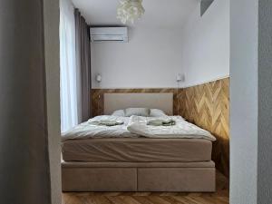 a bedroom with a bed in a room at LAM Design Greenery AC - Balcony in Bratislava