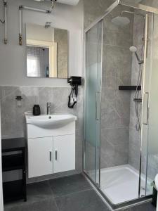 a bathroom with a sink and a shower at James Home in Quarto dʼAltino +15 photos