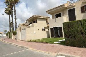 a building on the side of a street at On Beach Flamenca AMCH Hospedaje in Orihuela Costa