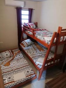 a pair of bunk beds in a room at Cozy apartment close to everything in Asunción
