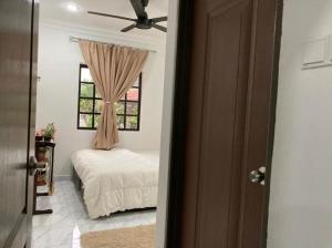 a bedroom with a bed and a window at Msy Residence in Shah Alam +33 photos