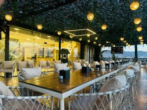 a restaurant with a long table and chairs at Grand Season Hotel in Aqaba +43 photos