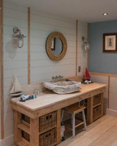 a bathroom with a wooden counter with a sink at Crab Manor Hotel in Thirsk +135 photos