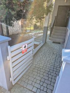 a white fence with a no entry sign on it at Chillout Place in Wieprz