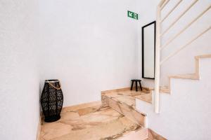 a staircase in a house with white walls and marble floors at Manomar II, tu refugio en Gata in Gata +17 photos