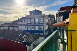 a view of a city with buildings and roofs at Clérigos Cinema Guesthouse in Porto