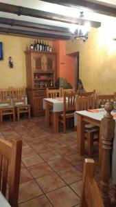 A restaurant or other place to eat at Hostal El Bodegon