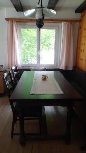 a table in a room with a window at Salü 5 in Saas-Fee