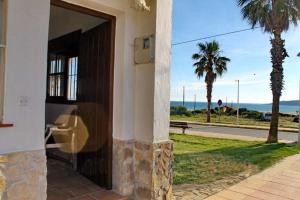 a door to a building with a view of the ocean at BOL16 in Bolonia