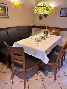 a dining room table with wine glasses on it at Ferienhaus Knecht in Neef