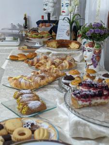 a buffet of pastries and pastries on a table at Oasi Del Gabbiano in Syracuse
