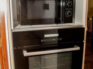 a microwave oven sitting inside of a kitchen at Mount Lily Mirissa in Mirissa