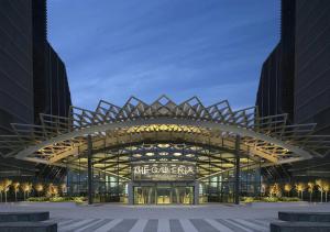 a large building with a sign in front of it at Modern Waterfront Studio | Steps from Cleveland Clinic in Abu Dhabi