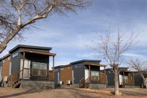 a row of modular homes with balconies at Page Lake Powell Campground - Tiny Home King Room in Page