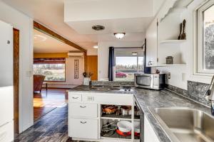 a kitchen with a sink and a counter top at Secluded Albany Escape, Pet Friendly w/ Fee in Albany