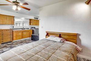 a bedroom with a bed and a kitchen at Secluded Albany Escape, Pet Friendly w/ Fee in Albany