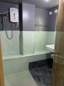 a bathroom with a shower and a sink at Dilco Villa Ahangama in Ahangama +3 photos