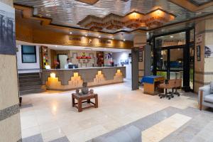 a lobby of a restaurant with a bar at Gaddis Hotel, Suites and Apartments in Luxor +122 photos
