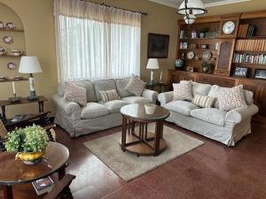 a living room with a couch and a table at Casa Rural Malpais Trece in Garachico