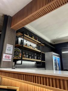 a bar in a restaurant with a counter at Yellow Umbrella Hostels in Cebu City