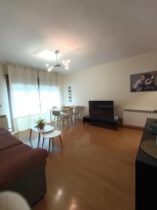a living room with a couch and a table at Piso Rualte in Ávila