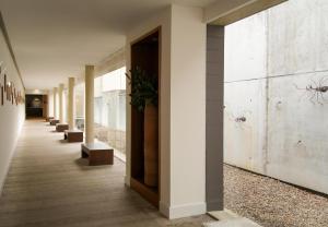 a hallway of a building witharantulas on the wall at Blau Hotel Las Caldas, a member of Radisson Individuals in Las Caldas +116 photos