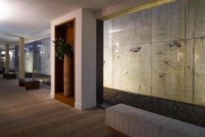 a hallway with a wall with spiders on it at Blau Hotel Las Caldas, a member of Radisson Individuals in Las Caldas