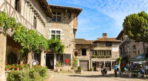 a street in a medieval town with buildings at Hostellerie du Vieux Pérouges in Pérouges