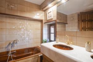 a bathroom with a sink and a tub at Pla de Moixons in Oristá +98 photos