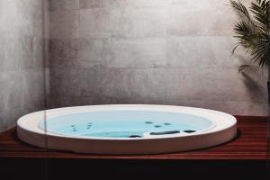 a bath tub sitting on a table in a bathroom at Douro Country House in Cinfães
