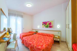 Кровать или кровати в номере Villaggio Mare Blu