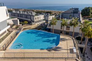 an overhead view of a swimming pool on a building at Iconic Sea View in Gran Alacant