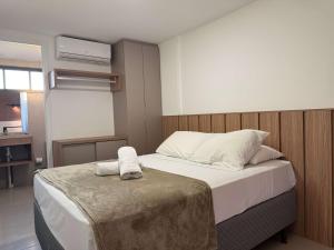 a bedroom with a bed with two towels on it at Sunny Hall by AFT in Porto De Galinhas +36 photos