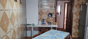 a dining room with a table and a table and a wall at Oleggio apartment in Oleggio +33 photos