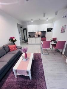 a living room with a couch and a table at Basilica Apartments in Budapest