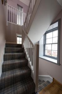 a staircase in a house with a window at Tangle Tower in Inverness