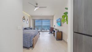 a bedroom with a bed and a view of the ocean at Elegant Beachfront Getaway with Unmatched Views in Puerto Peñasco +23 photos